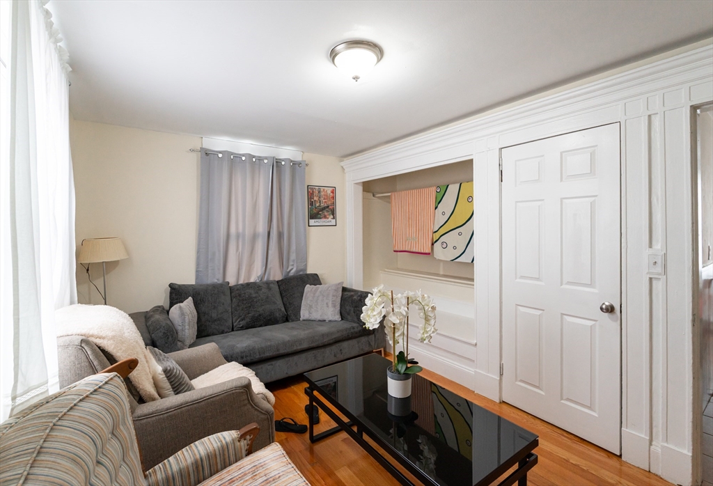 18 Edson Street Lowell, MA 01851 - Photo 18 of 41 a living room with furniture and a window