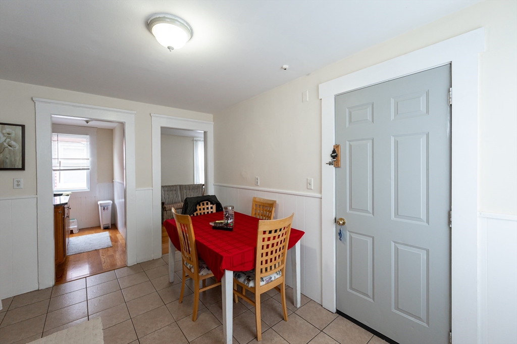 18 Edson Street Lowell, MA 01851 - Photo 19 of 41 a view of a room with furniture and wooden floor