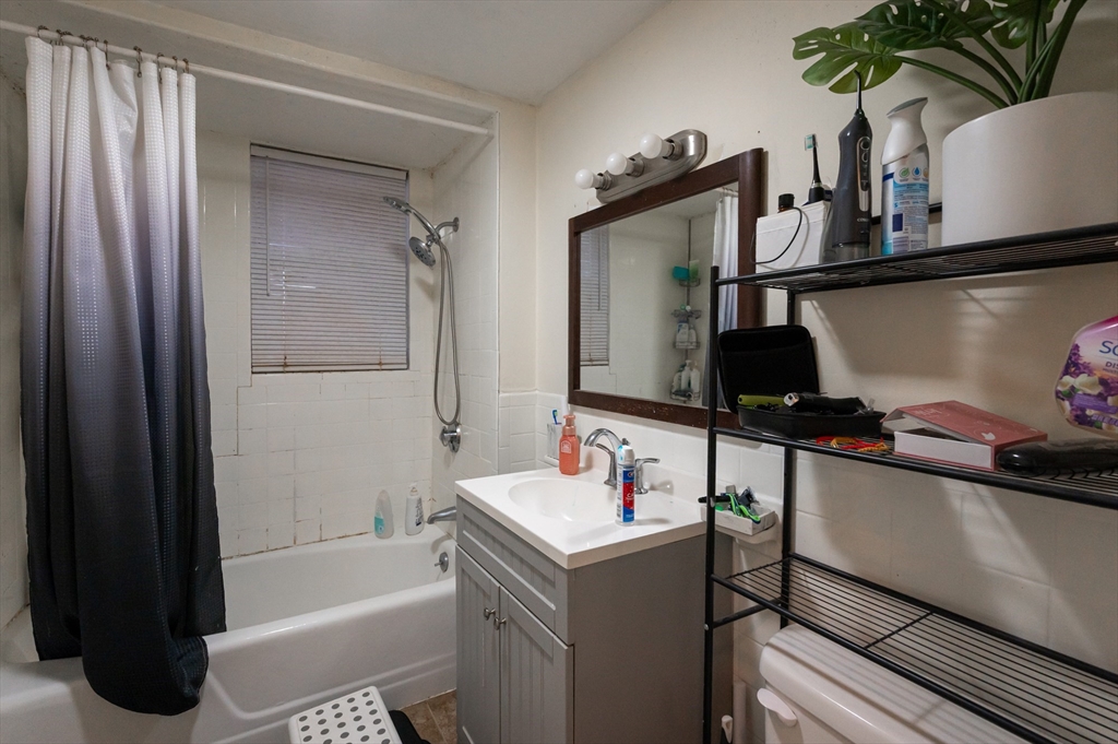 18 Edson Street Lowell, MA 01851 - Photo 23 of 41 a room with a window and storage space