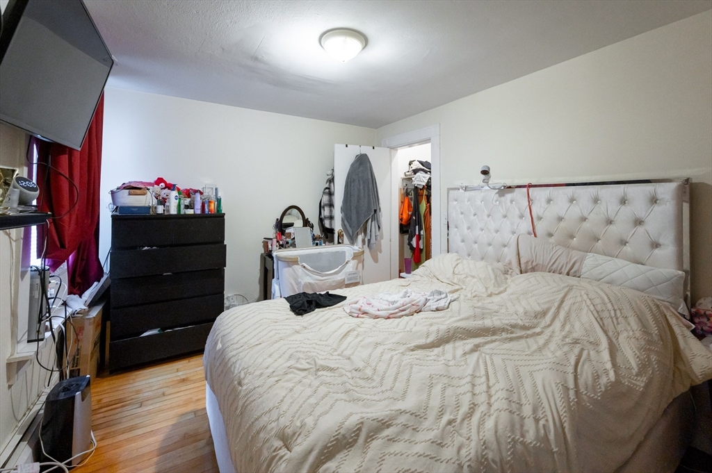 18 Edson Street Lowell, MA 01851 - Photo 31 of 41 a bed room with a bed and a closet