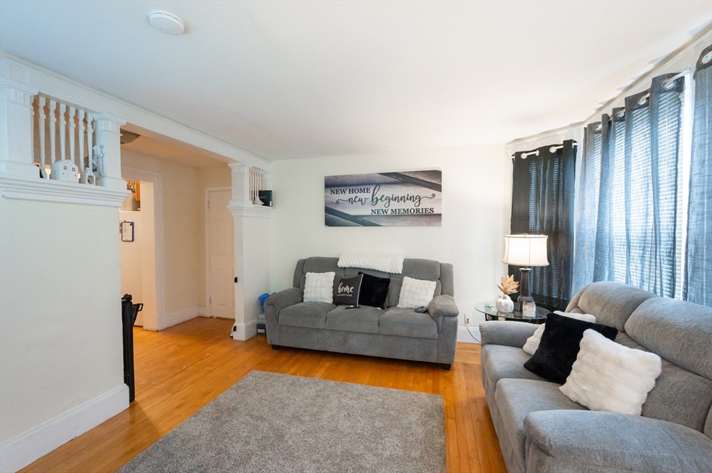 18 Edson Street Lowell, MA 01851 - Photo 34 of 41 a living room with furniture and a window