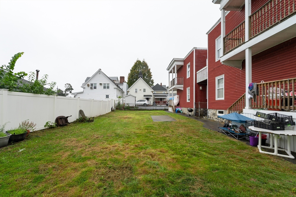 18 Edson Street Lowell, MA 01851 - Photo 38 of 41 a view of yard with swimming pool and green space