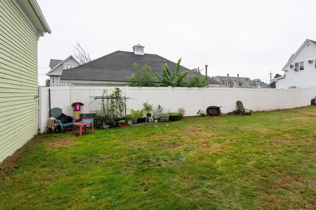 18 Edson Street Lowell, MA 01851 - Photo 39 of 41 a view of a house with backyard and sitting area