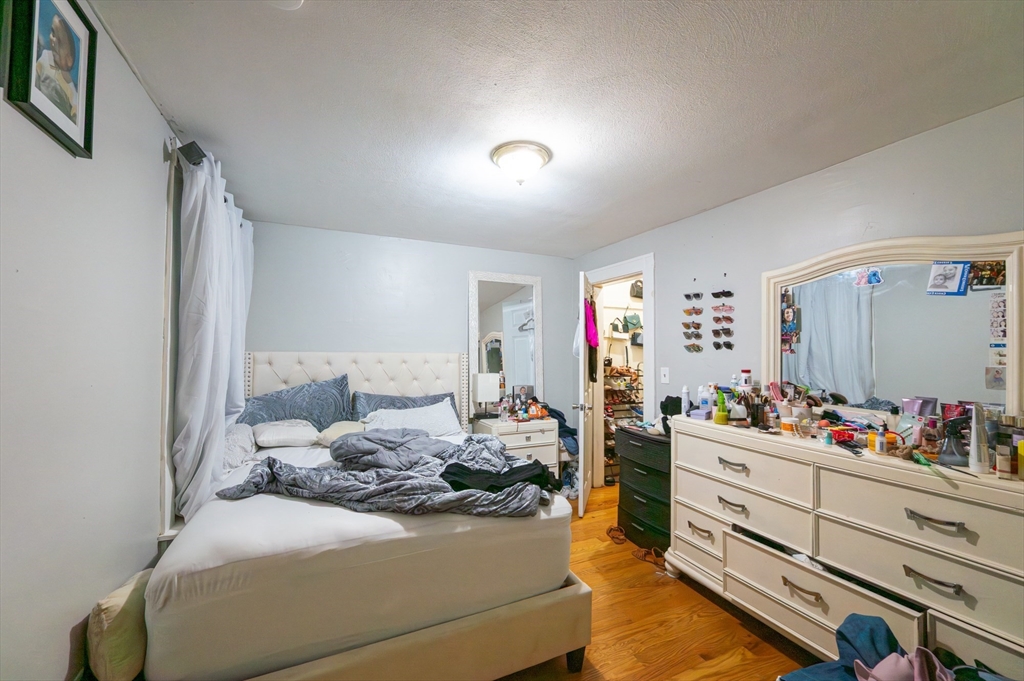 18 Edson Street Lowell, MA 01851 - Photo 4 of 41 a bedroom with a bed and a closet