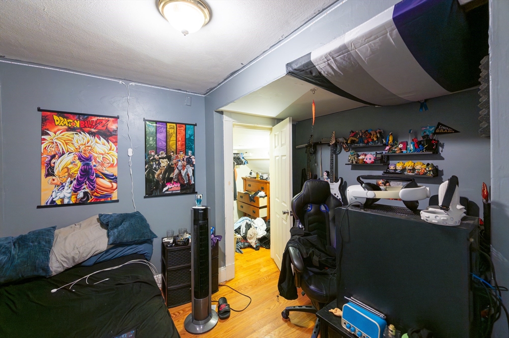 18 Edson Street Lowell, MA 01851 - Photo 6 of 41 a view of a workspace with furniture and toys