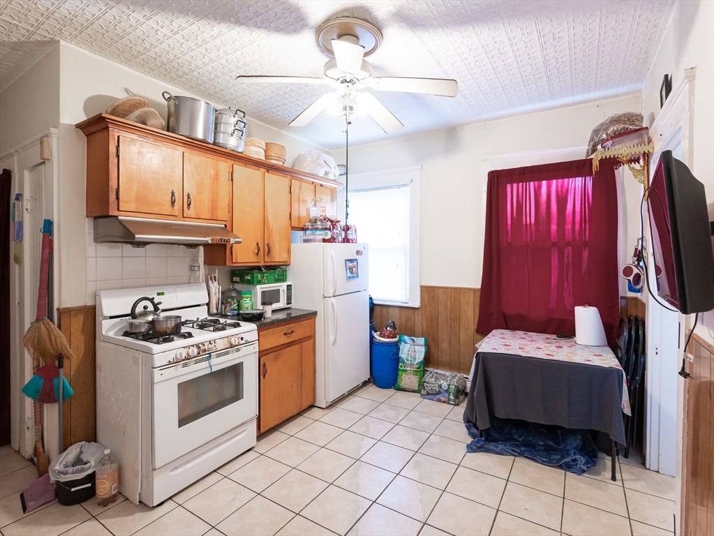 18 Edson Street Lowell, MA 01851 - Photo 8 of 41 a kitchen with a sink appliances and cabinets