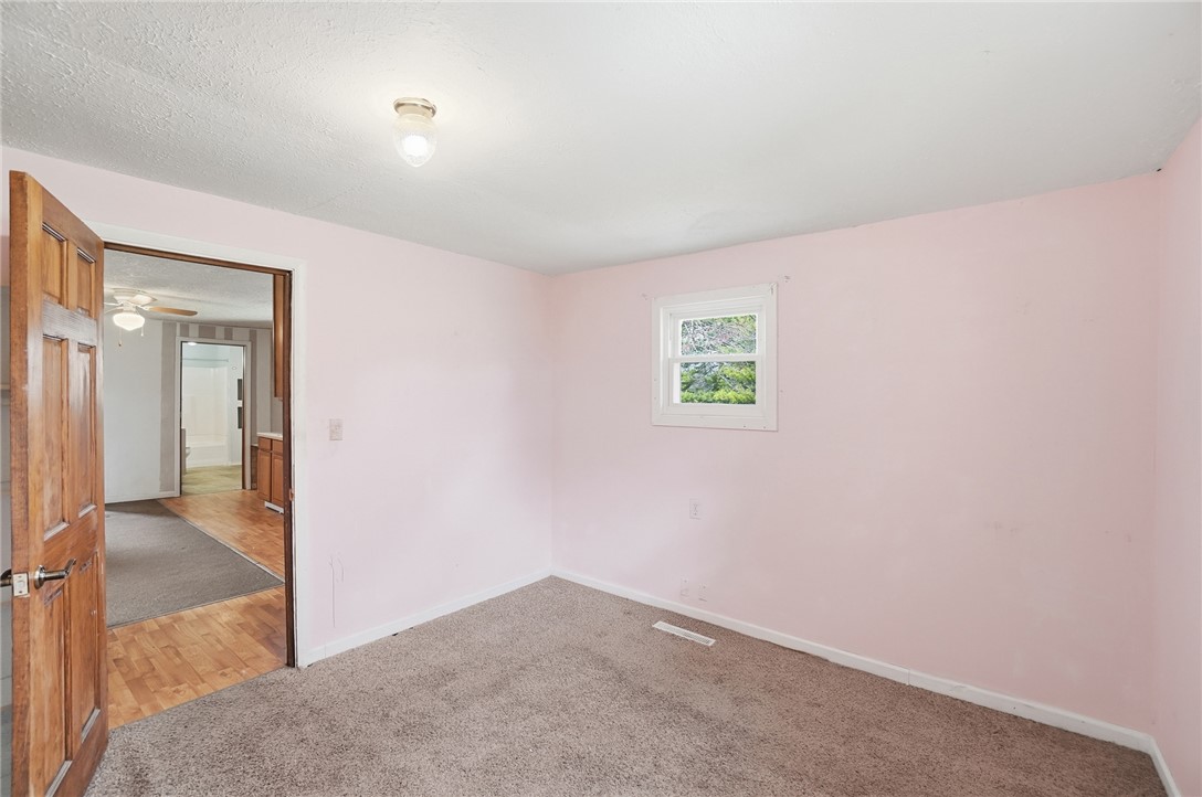 1166 West Sparrow Road Springfield, OH 45502 - Photo 31 of 40 This cozy bedroom features soft tones and durable carpeting, offering a tranquil retreat.