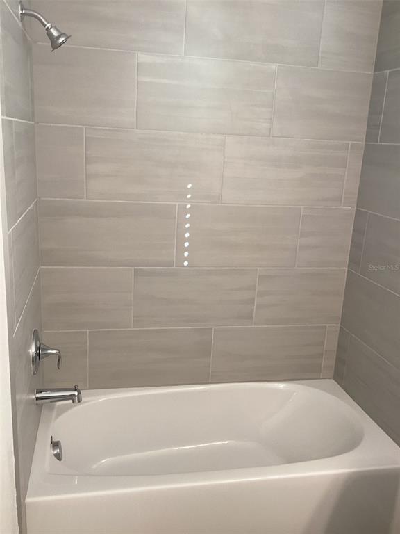 7898 Southwest 74th Loop Ocala, FL 34481 - Photo 11 of 23 a bathroom with a bathtub