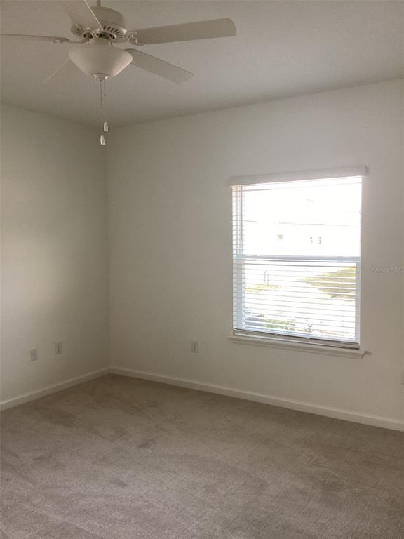 7898 Southwest 74th Loop Ocala, FL 34481 - Photo 13 of 23 an empty room with a window