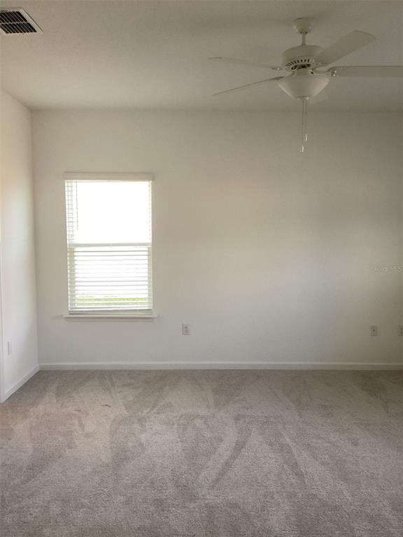 7898 Southwest 74th Loop Ocala, FL 34481 - Photo 14 of 23 an empty room with a window