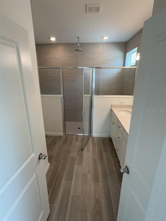 7898 Southwest 74th Loop Ocala, FL 34481 - Photo 15 of 23 a view of an empty room with wooden floor and staircase