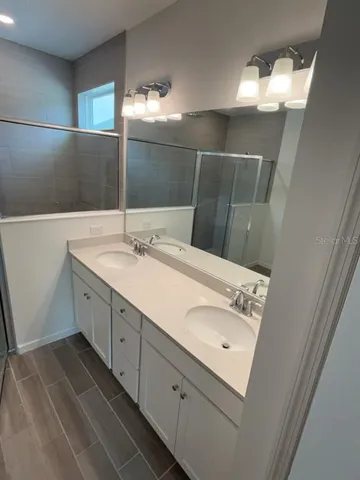 a bathroom with a sink and mirror