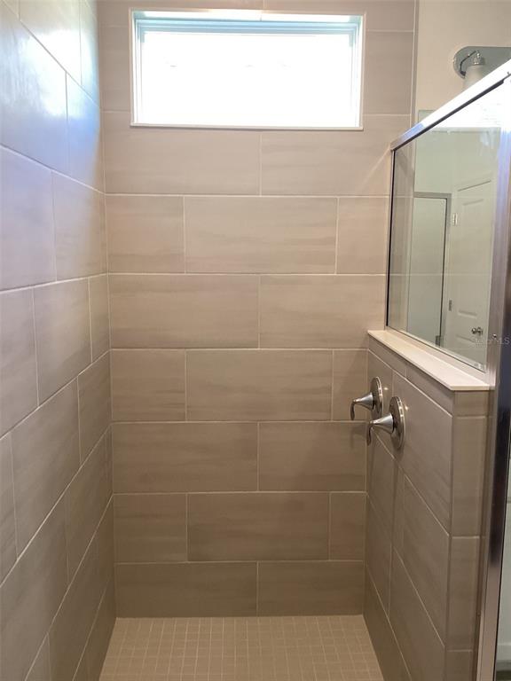 7898 Southwest 74th Loop Ocala, FL 34481 - Photo 19 of 23 a bathroom with a shower