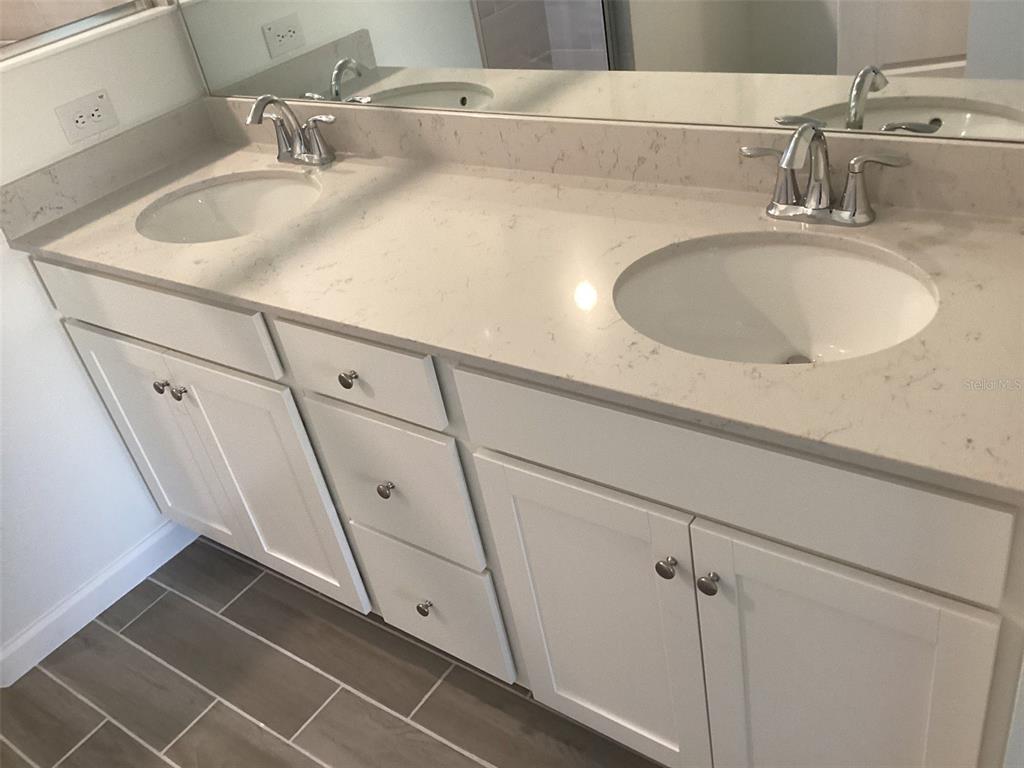 7898 Southwest 74th Loop Ocala, FL 34481 - Photo 20 of 23 a bathroom with a sink and a mirror