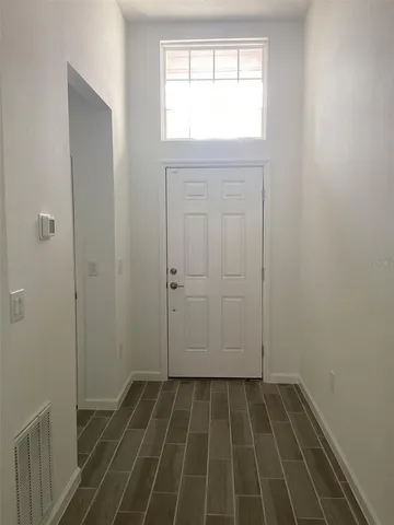 a view of an empty room and window