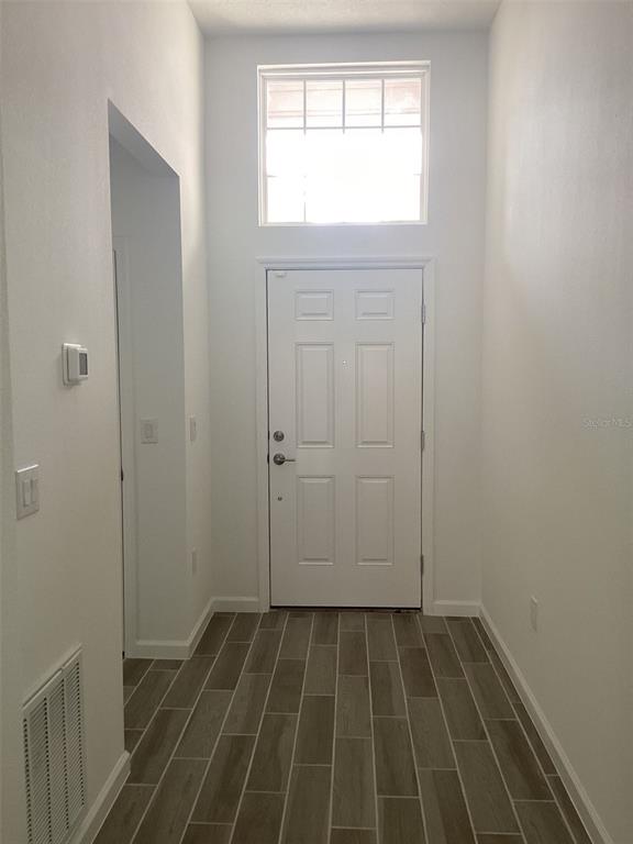 7898 Southwest 74th Loop Ocala, FL 34481 - Photo 2 of 23 a view of an empty room and window