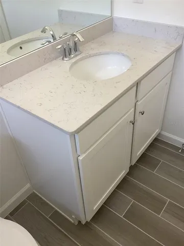 a bathroom with a sink and vanity