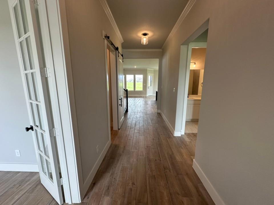 390 Cobb Road Leonard, TX 75452 - Photo 4 of 26 Hallway featuring wood-look tile flooring, crown molding, and recessed lighting