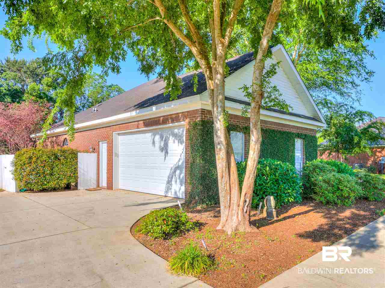 9886 Merritt Court Fairhope, AL 36532 - Photo 7 of 39 Garage has work area and cooled with window unit