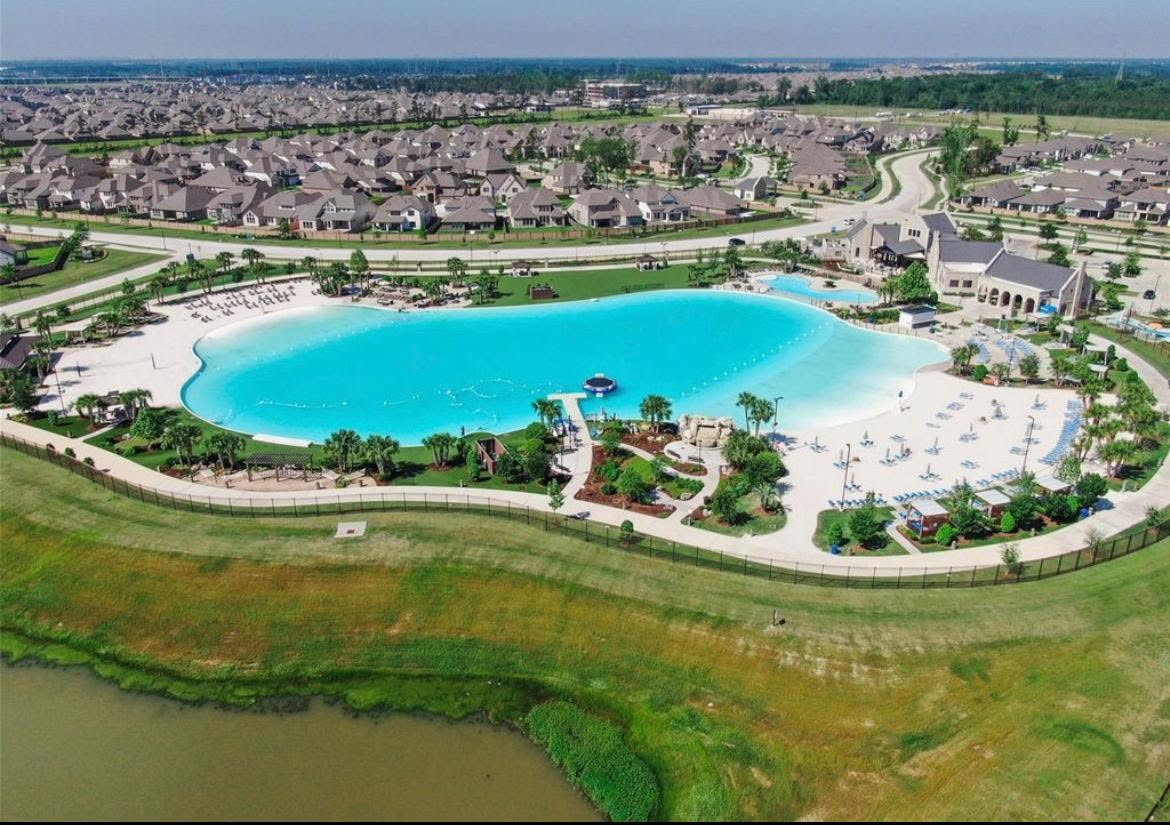 15814 Weston Ridge Drive Humble, TX 77346 - Photo 41 of 43 Discover your oasis with this stunning crystal-clear lagoon, offering resort-style relaxation and breathtaking views right in your neighborhood.
