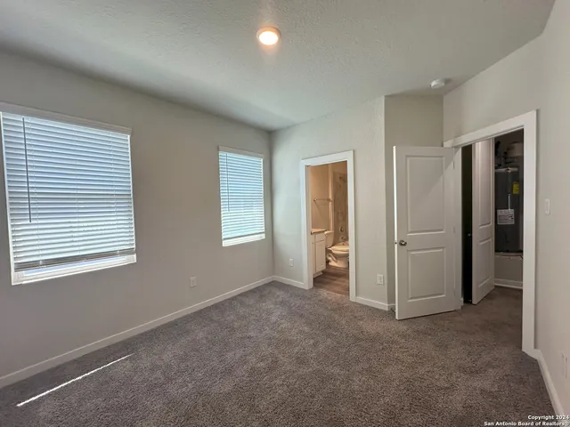 a bathroom with a granite countertop toilet sink and shower