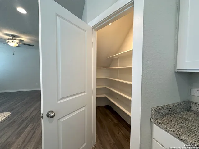 a view of storage and utility room in closet