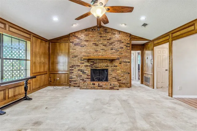 a view of livingroom with hardwood floor and a hallway