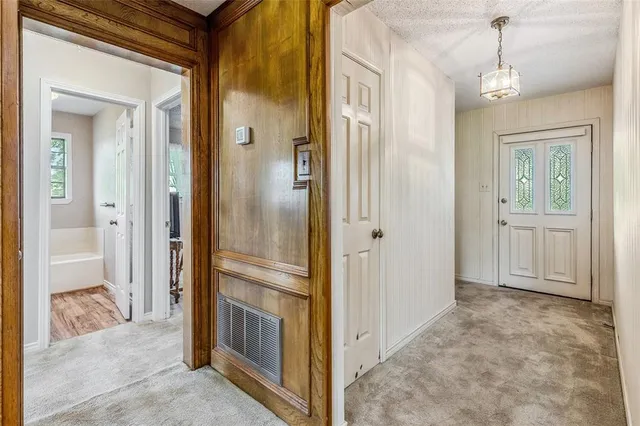 a dining room with furniture window and wooden floor