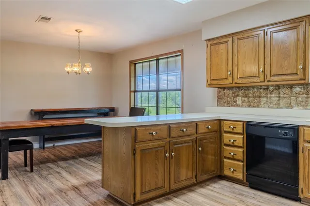 a kitchen with stainless steel appliances granite countertop a sink and cabinets