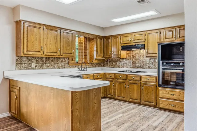 a view of a sink and a window