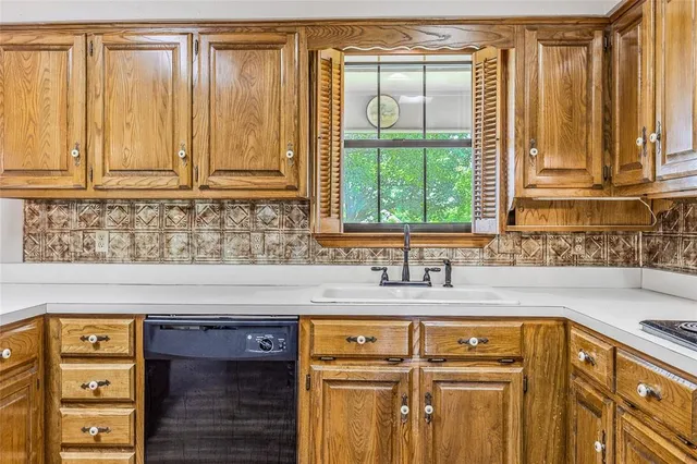 a view of a livingroom with a fireplace and wooden floor