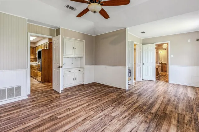 a workspace with furniture and chandelier