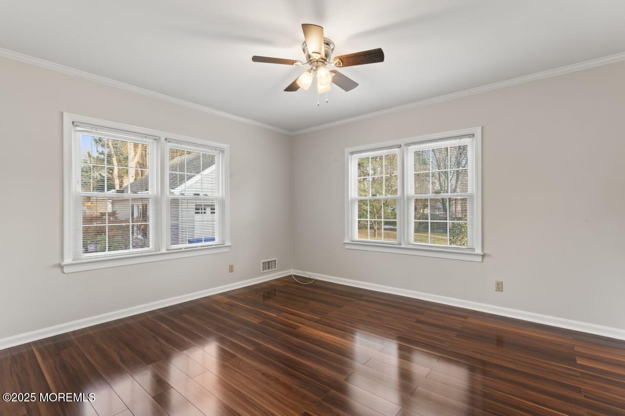 31 Phalanx Road Lincroft, NJ 07738 - Photo 14 of 28 a view of an empty room with wooden floor and a window