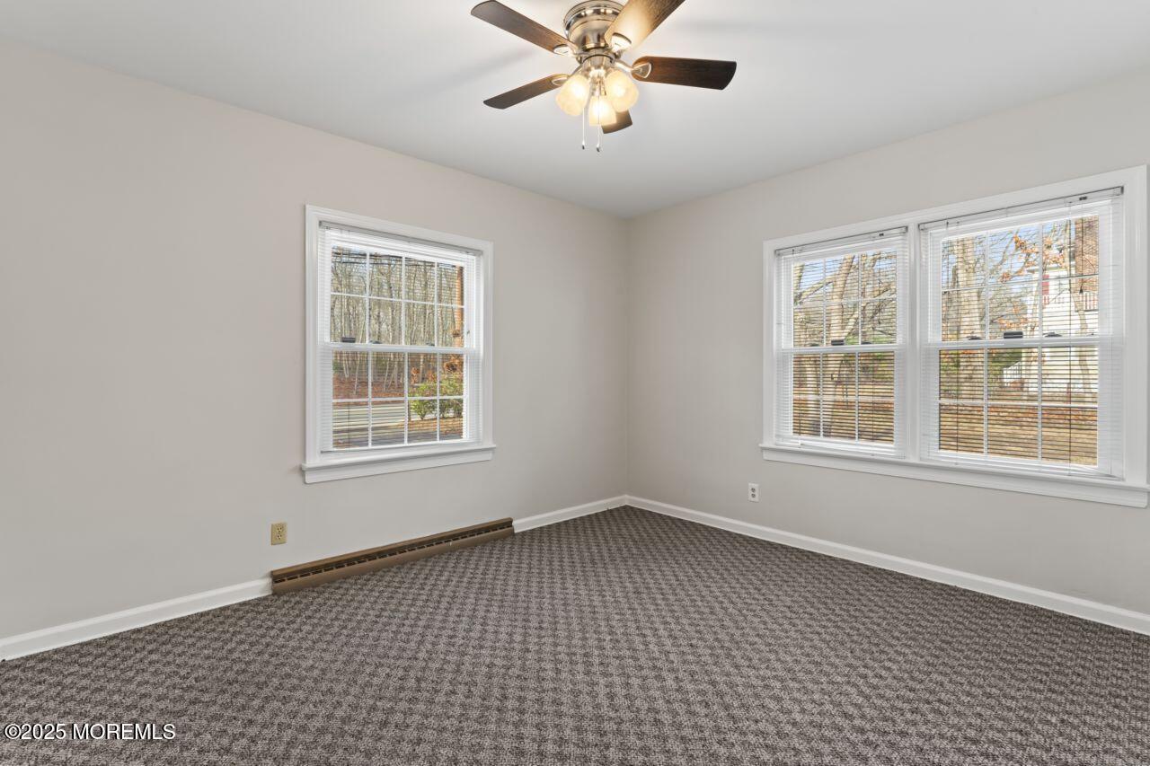 31 Phalanx Road Lincroft, NJ 07738 - Photo 15 of 28 a view of an empty room with a window