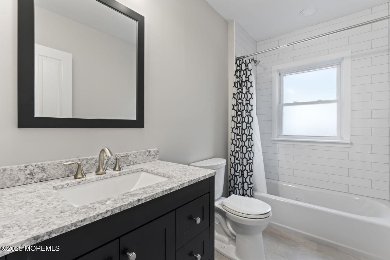 31 Phalanx Road Lincroft, NJ 07738 - Photo 16 of 28 a bathroom with a granite countertop sink toilet and shower