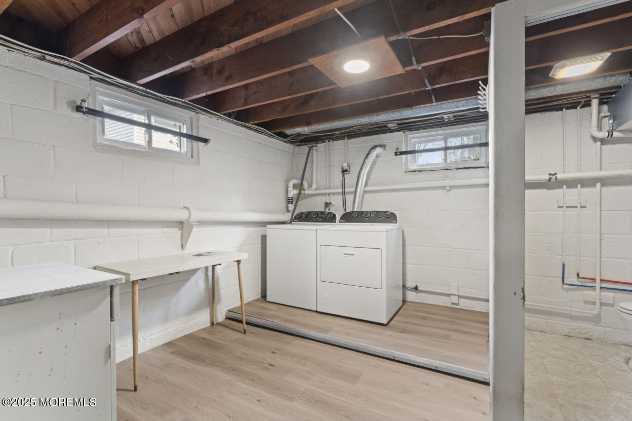 31 Phalanx Road Lincroft, NJ 07738 - Photo 18 of 28 a utility room with cabinets washer and dryer