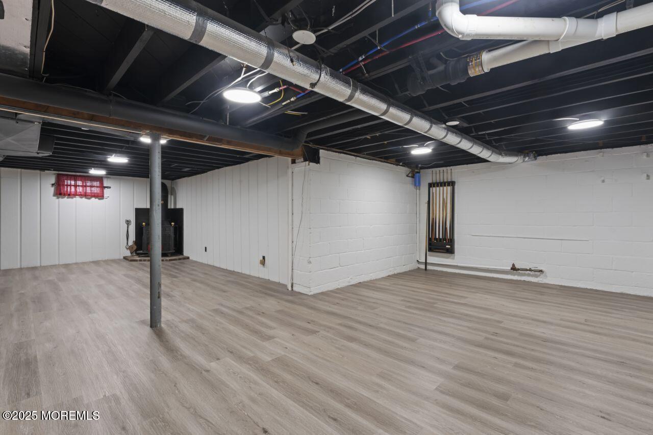 31 Phalanx Road Lincroft, NJ 07738 - Photo 19 of 28 a view of an empty room with wooden floor