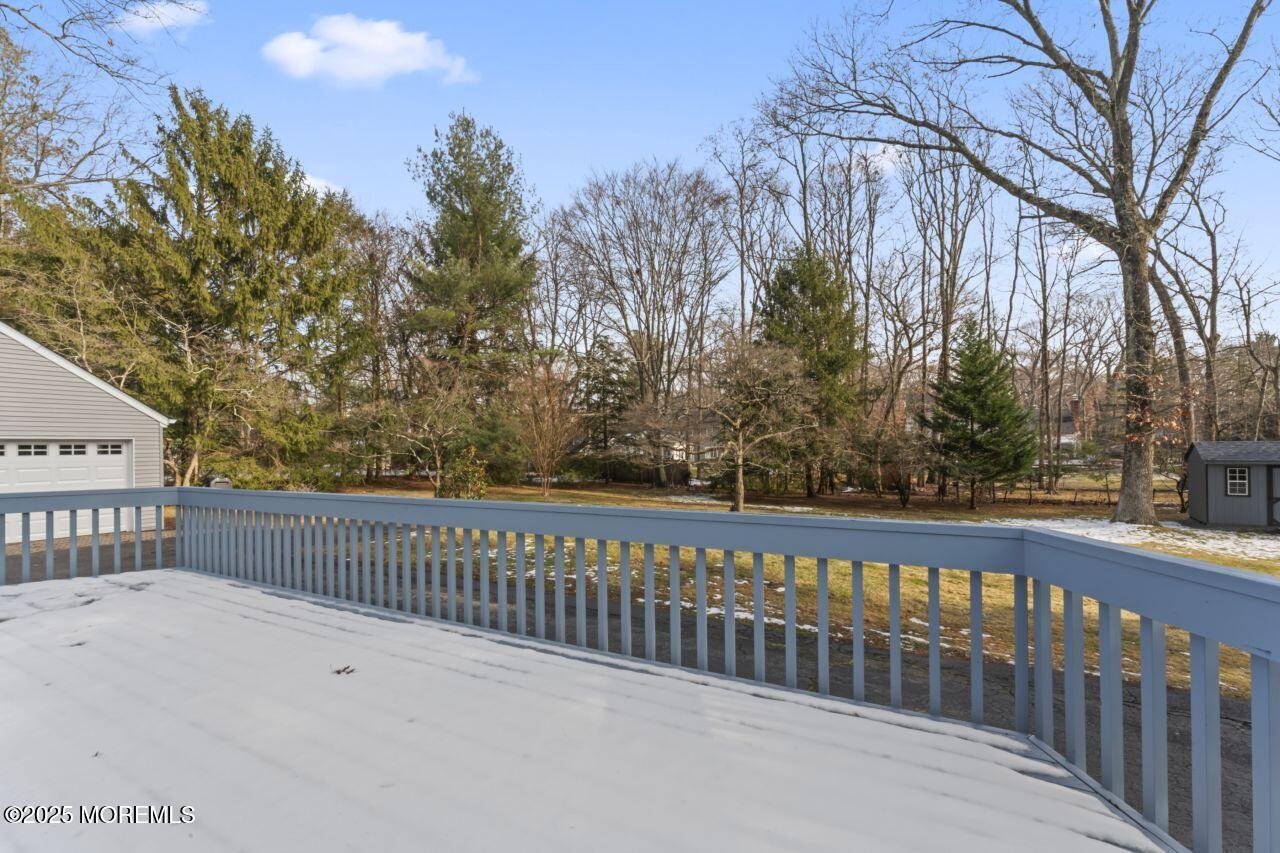 31 Phalanx Road Lincroft, NJ 07738 - Photo 4 of 28 a view of a balcony with a small yard
