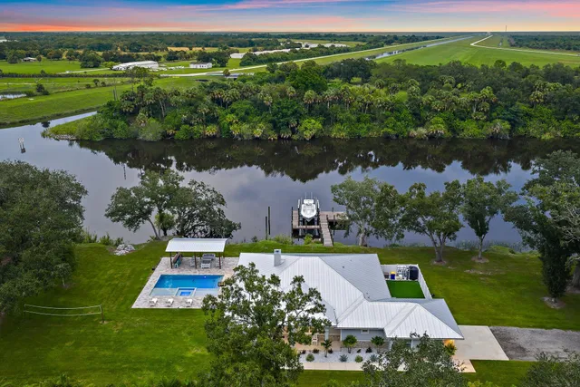 an aerial view of a house with garden space and outdoor space