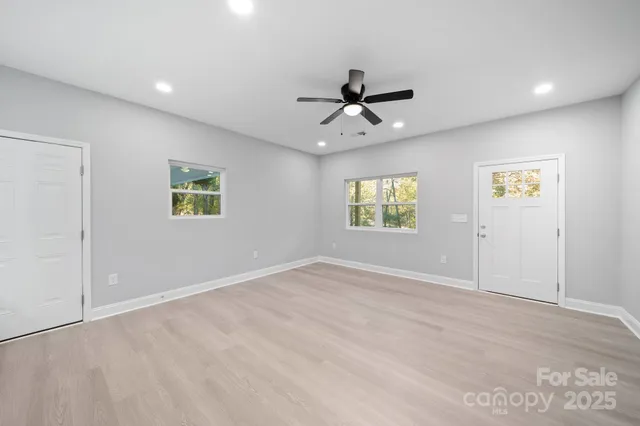 a view of an empty room with a window