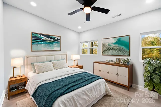 a bedroom with a large bed and a window