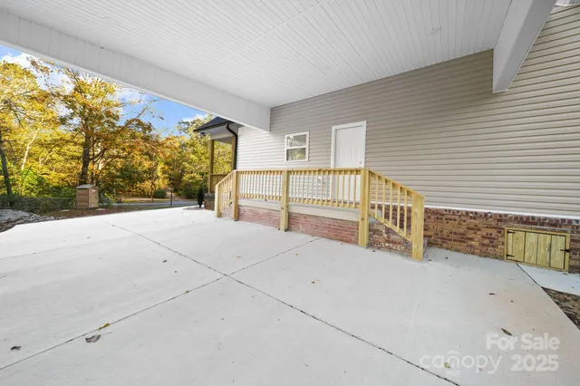 a view of a house with a wooden fence
