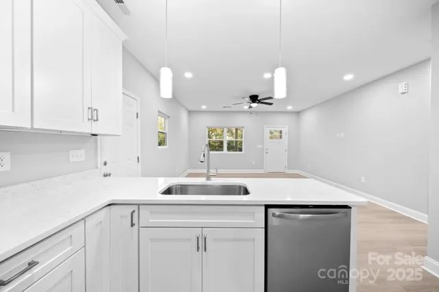 a kitchen with a sink and a refrigerator