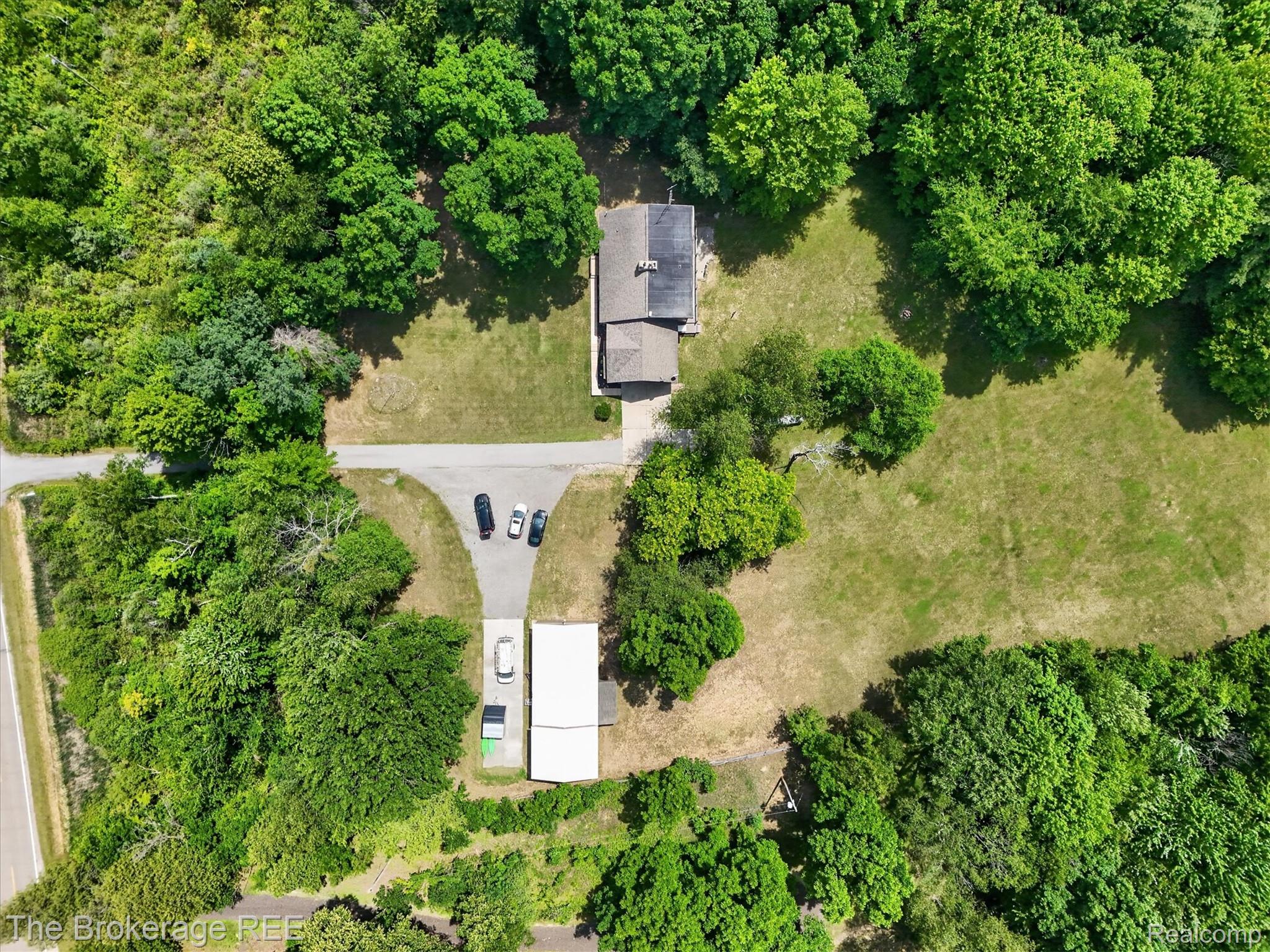 13269 North Genesee Road Clio, MI 48420 - Photo 55 of 67 Expansive property featuring a residence, detached carport, a separate drive, mature trees, and surrounding greenery