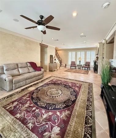 a living room with couch and a rug