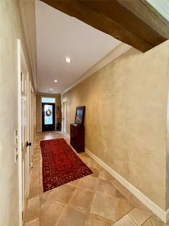 a living room with a couch and a rug