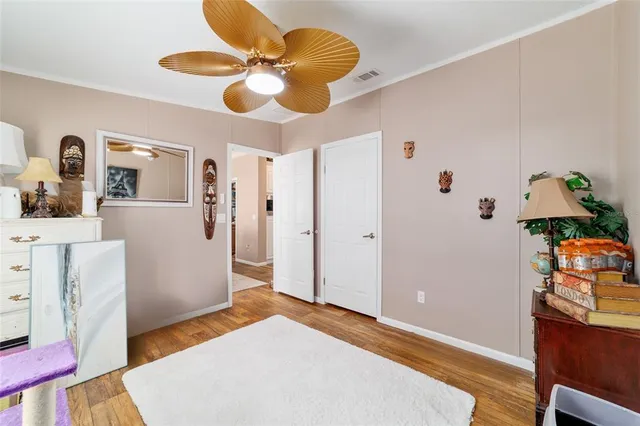 a view of a house with swimming pool and sitting area