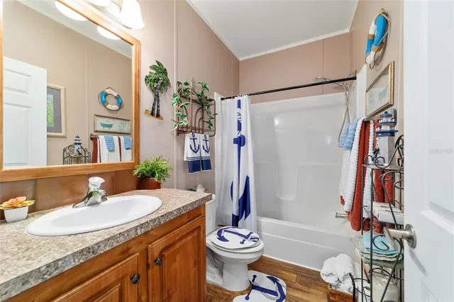 a view of a house with wooden deck and yard