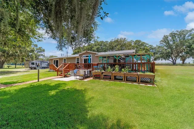 a backyard of a house with lots of green space