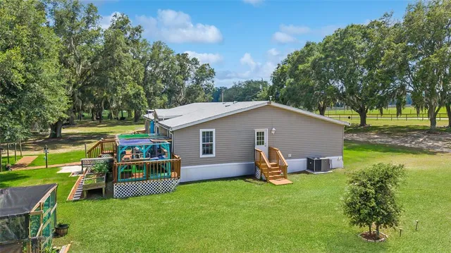 a view of a balcony with lake view and wooden floor